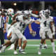 Dec 16, 2023; Atlanta, GA, USA; Howard Bison defensive lineman Ian White (14) reacts after an interception against the Florida A&M Rattlers in the first half at Mercedes-Benz Stadium.